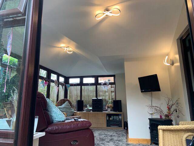 Modern conservatory extension interior in Devon with solid insulated roof and vaulted ceiling