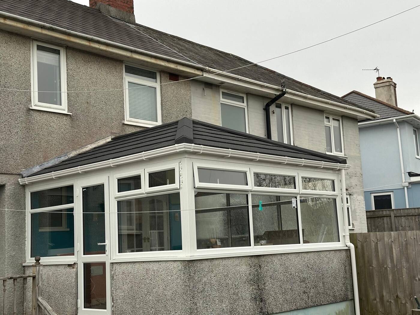 Conservatory roof renovation on a Plymouth semi-detached home with anthracite tiled finish